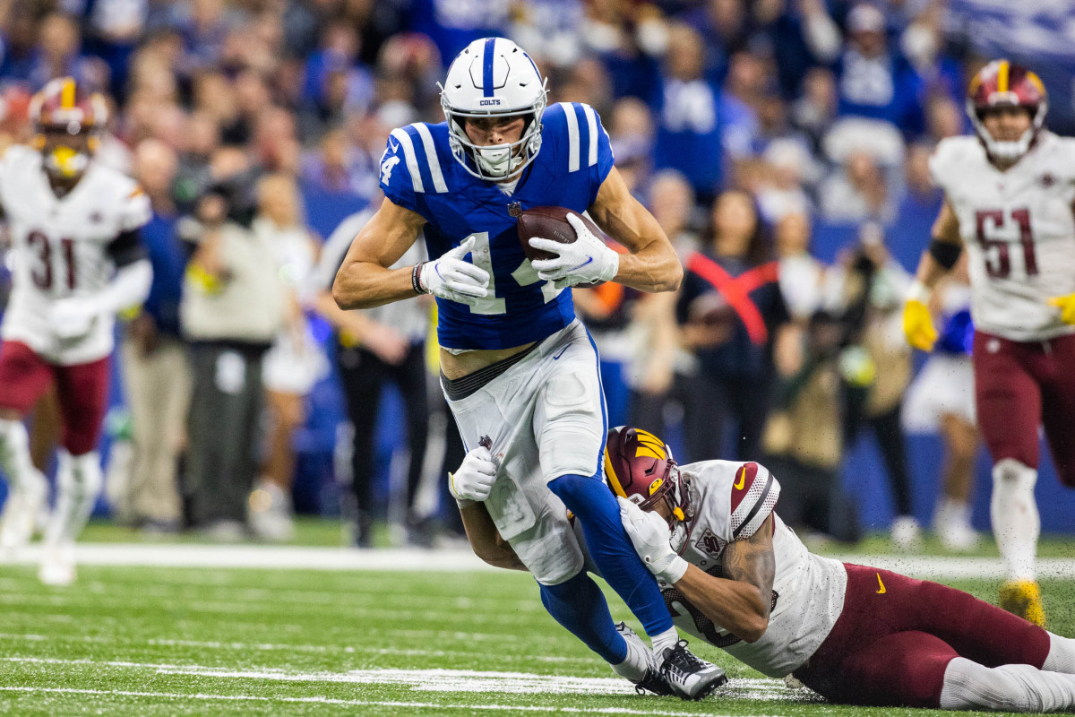 Oct 30, 2022; Indianapolis, Indiana, USA; Indianapolis Colts wide receiver Alec Pierce (14) catches the ball while Washington Commanders cornerback Benjamin St-Juste (25) defends in the second half at Lucas Oil Stadium.